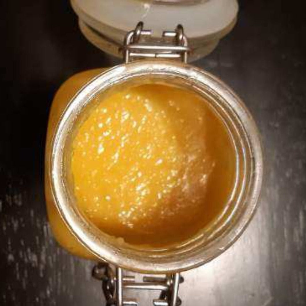 Braiding Butter top down into open glass container